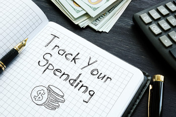 Track Your Spending is shown on the conceptual business photo
