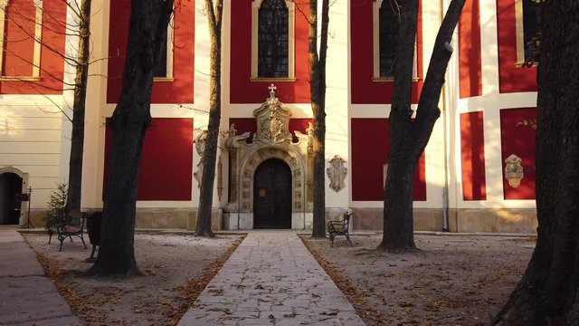 Walking to the door of an ortodox church Szentendre Cathedral in Hungary