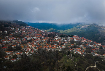 Aerial cloudy sunset with mountains near Metsovo in Epirus, Greece