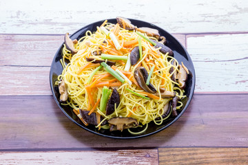 Chiness noodle on black plate