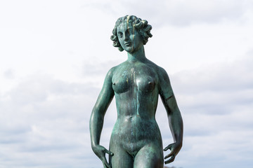 Obraz premium Statues Dansen, The Dance, by Carl Eldh in front of old town (Gamla Stan), Stockholm, Sweden