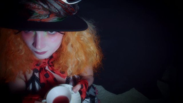 4k Woman Dressed up as Madhatter Posing with Tea Cup