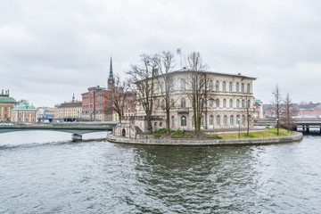 Fototapeta premium Beautiful buildings at the bank of the strait and islands in the downtown of Stockholm, Sweden.
