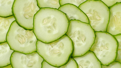 fresh cucumber sliced, isolated on a white background. top view