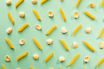 Raw pasta pattern on color surface