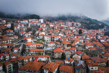 Naklejka na ściany i meble Aerial view of traditional houses at Metsovo is a town in Epirus, in the mountains of Pindus in northern Greece