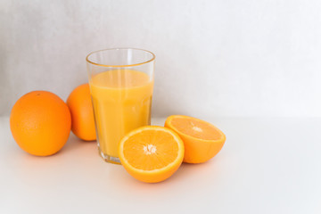Oranges and juice-fresh on a white background.