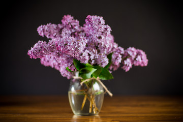 bouquet of beautiful spring flowers of lilac on the table