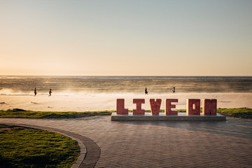 Live on large letters art installation in Camp's bay Cape town. Motivational and inspirational.