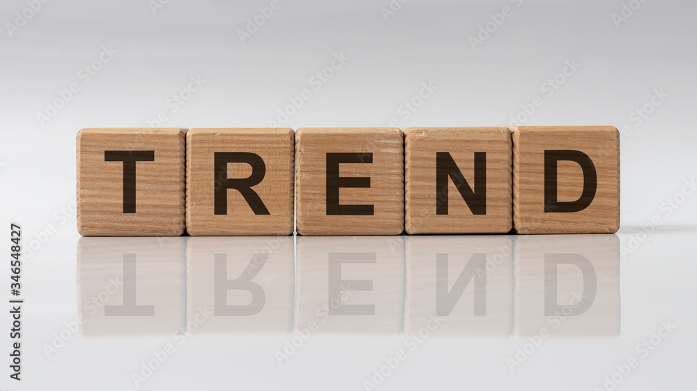Poster trend word on cube blocks on white grey glossy background with reflection