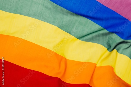LGBT flag blown in the wind. Freedom and love concept. Pride month in June.