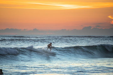 Sunset with surfing in Bali