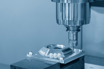 The  CNC  milling machine cutting  the mold parts by solid endmill tool. The hi-technology mold and die manufacturing concept by machining center.