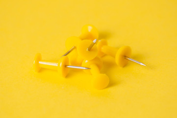 Push pins on a yellow background. Team building, business and sales concept