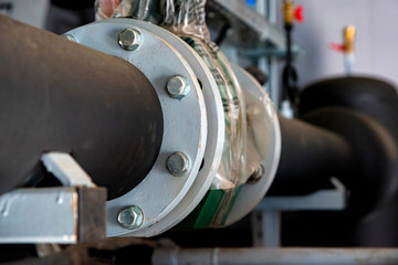 Close up black valves plug on plastic pipe