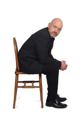 portrait of a man sitting on a chair on  white background,