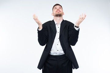 Man is looking up. Concept - guy wonders why he is in misfortune. Concept - businessman turns to...