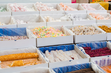 Assorted Turkish Delight. Traditional eastern sweets on market. Turkish colorful desserts Lokum.
