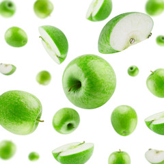 Apples Flying in Air on White Background. Set of Falling Green Apples Whole and Sliced