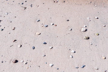 Fototapeta na wymiar .river bank close up sand stones