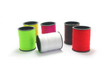 Mul-ti color thread roll isolated on white background.