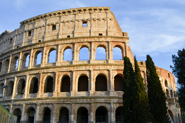 Fototapeta na wymiar View on the exterior of the Colosseum during sunset