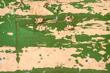 Vintage wood background with green peeling paint.