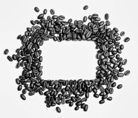 Frame of roasted brown coffee beans isolated on white may use as background or texture.