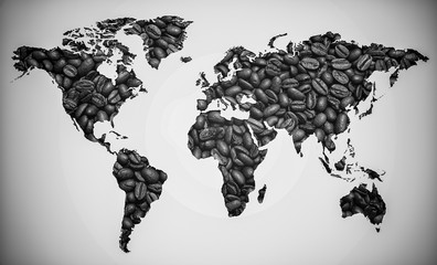 Map of the world made of roasted arabic coffee beans on white paper background. International coffee industry or travel planning concept
