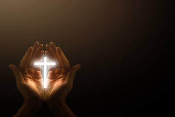 Light in the human hands in the dark