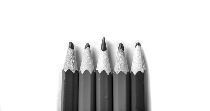 One sharpened pencil standing out from the blunt ones. It's easy to be beautiful if you do nothing concept. Red pencils on white.