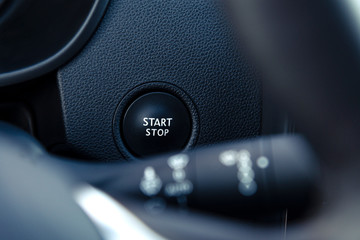 Engine start button in a modern car interior