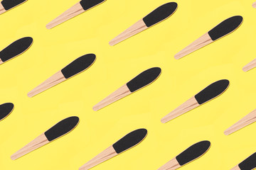 wooden pumice for heels on a green background