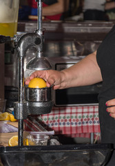 Vendor squeezing lemon for healthy lemon juice