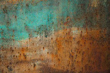 orange texture of rusty iron with traces of blue paint