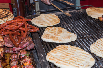 Pita bread on the grill during fast food festival, street food