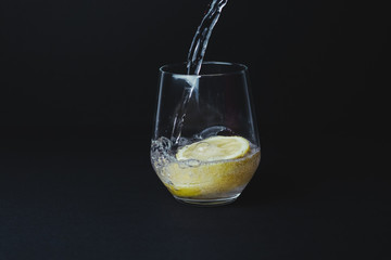 Gin tonic isolated on black background