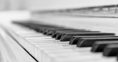 Close up white piano keyboard. Music instrument. Black and white key. Play sound, chord, melody....