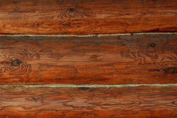 Brown, painted, wooden wall of beams. Background. Texture.