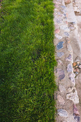 lawn and paved with boulders, steps down