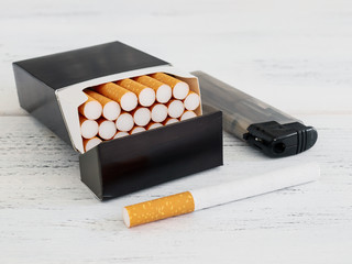 pack of cigarettes on a white wooden table