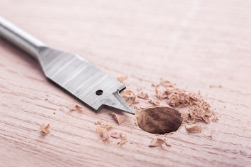metal drill bit paddle make holes in a wooden oaks plank