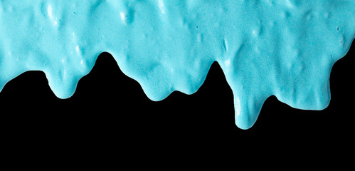 Blue slime isolated on black background.