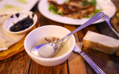 Peking duck in a plate on the table.