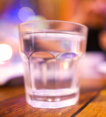 A glass glass stands on a table