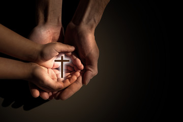Praying and teaching, child and adult praying together
