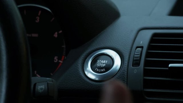 Pressing start button inside car to start motor