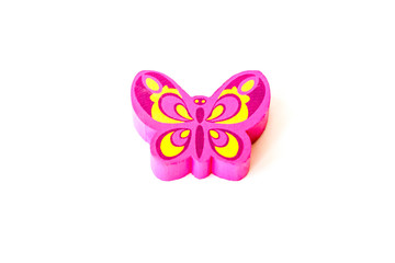 Wooden figure for children to play with. The butterfly shape. Butterfly made of pink wood