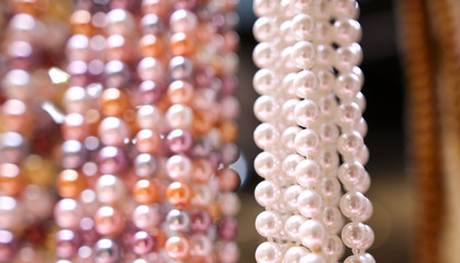 Pearl beads on a pink counter