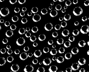 Air balls in water on a black background